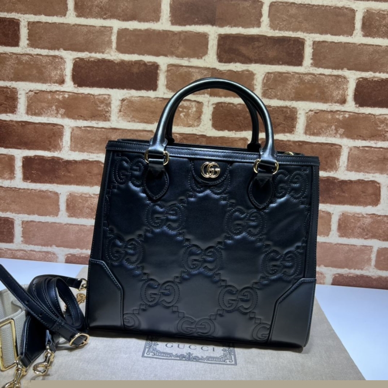 G*u*i shopping bags